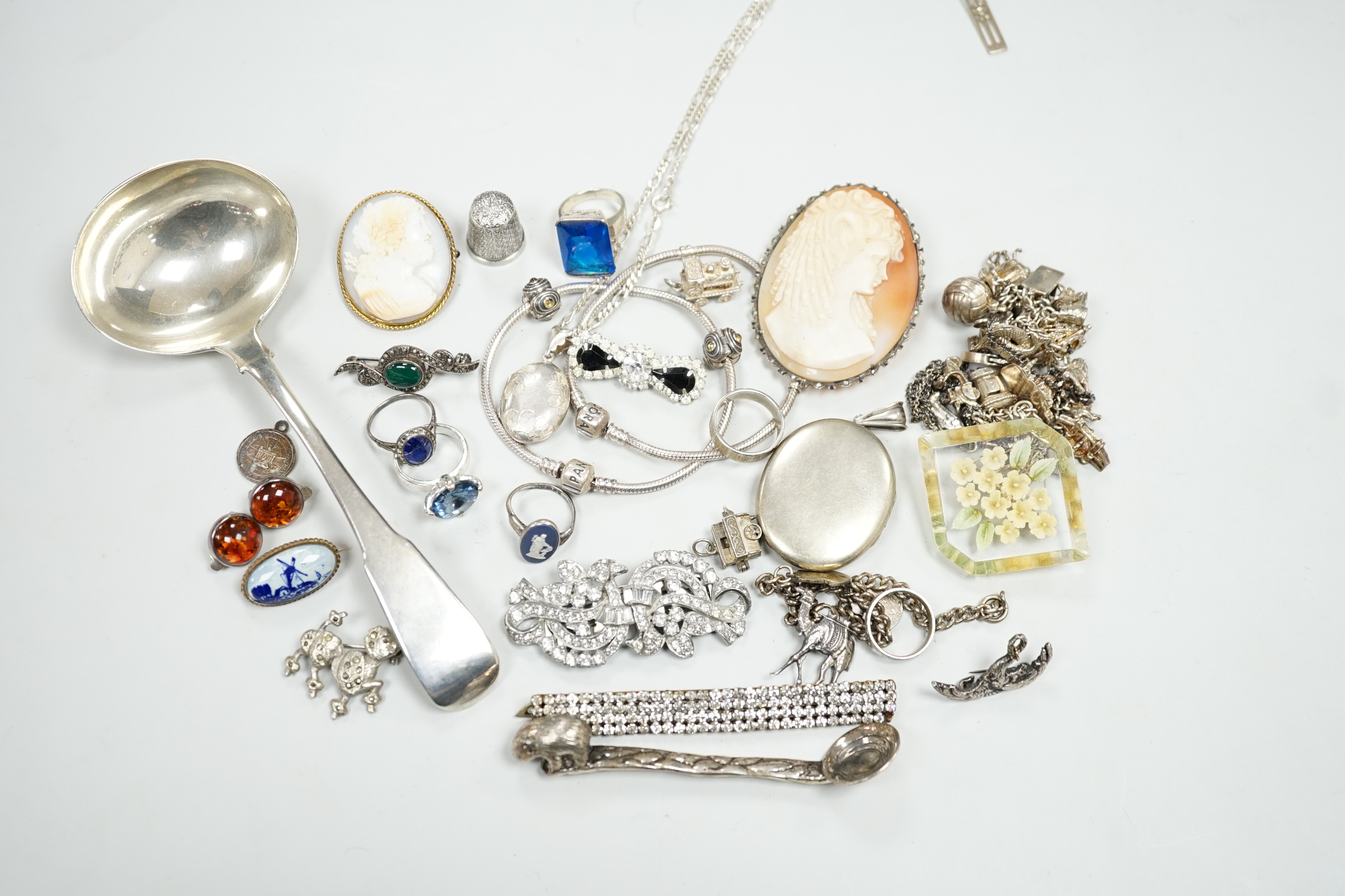 A George III silver sauce ladle, London, 1803 and a quantity of assorted jewellery including two white metal charm bracelets.